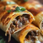 French Dip Tortilla Roll Ups served on a plate
