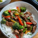 Meal prep beef stir-fry bowls served with jasmine rice for a healthy dinner option.